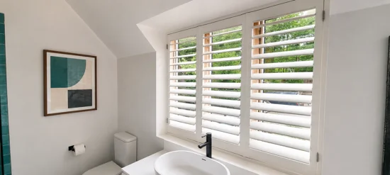 White shutters above a bathroom basin