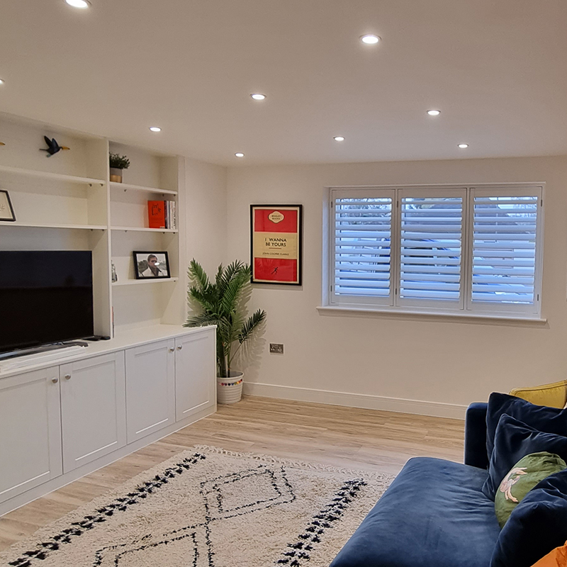 living room with hardwood shutters